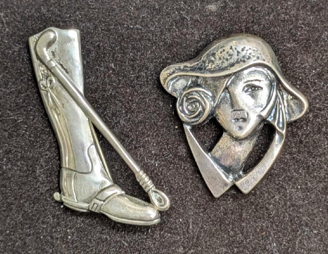 Vintage Sterling Silver Lady And Equestrian Boot Pin Broochs: Vintage Sterling Silver Lady And Equestrian Boot Pin Broochs. This lot includes: (1) Sterling Lady With Hat Brooch. This is marked .925 on the back and is approx 1 3/4" x 1 1/2" x 1/4"(1)
