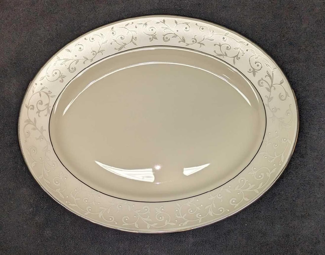 Retired Lenox Pearl Innocence China 13" Oval Platter: Retired Lenox Pearl Innocence China 13" Oval Platter. This series of fine bone china was released from the year 2002 to the year 2021. The platter is approx 13 1/4" x 1" x 10 1/2" and it weighs