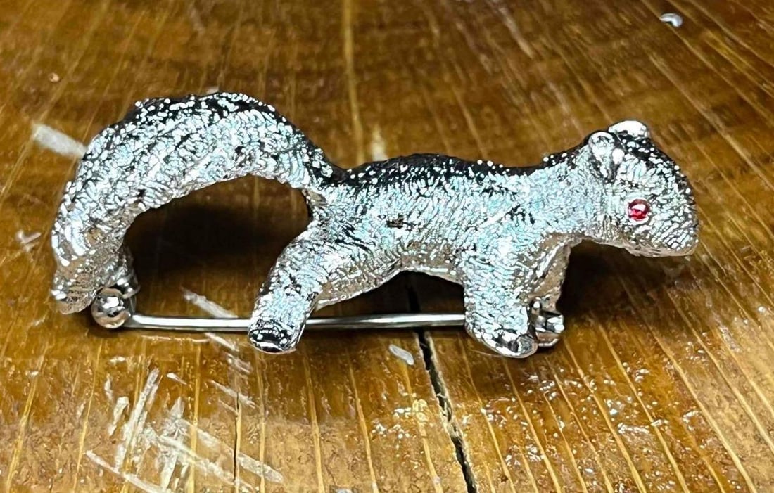 Vintage Signed Monet Silver Tone Squirrel Brooch With Rhinestone Eyes: This lot contains a Vintage Signed Monet Silver Tone Squirrel Brooch With Rhinestone Eyes. It is approx 1 3/4" x 1" x 3/4". Total weight is approx 0.4oz. Overall the Vintage Monet brooch is in