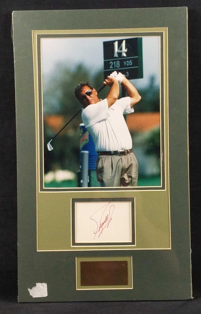 Fuzzy Zoeller Autographed Card With Matted Photo: Autographed card by golfing legend, Fuzzy Zoeller. The card comes with a photo of the golfer, along with a plaque with his name. All are kept together with a double-matting, making it very easy to fra