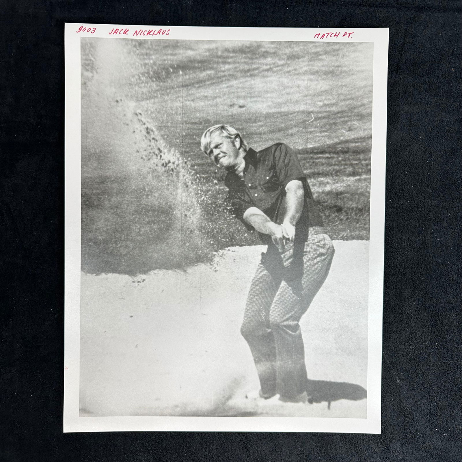 Jack Nicklaus Black and White Analog Photo Print Editorial Golf Photograph: Black and white analog photograph print of golf legend Jack Nicklaus mid-swing from a sand trap, showcasing his signature precision and calm under pressure. This vintage editorial proof print includes