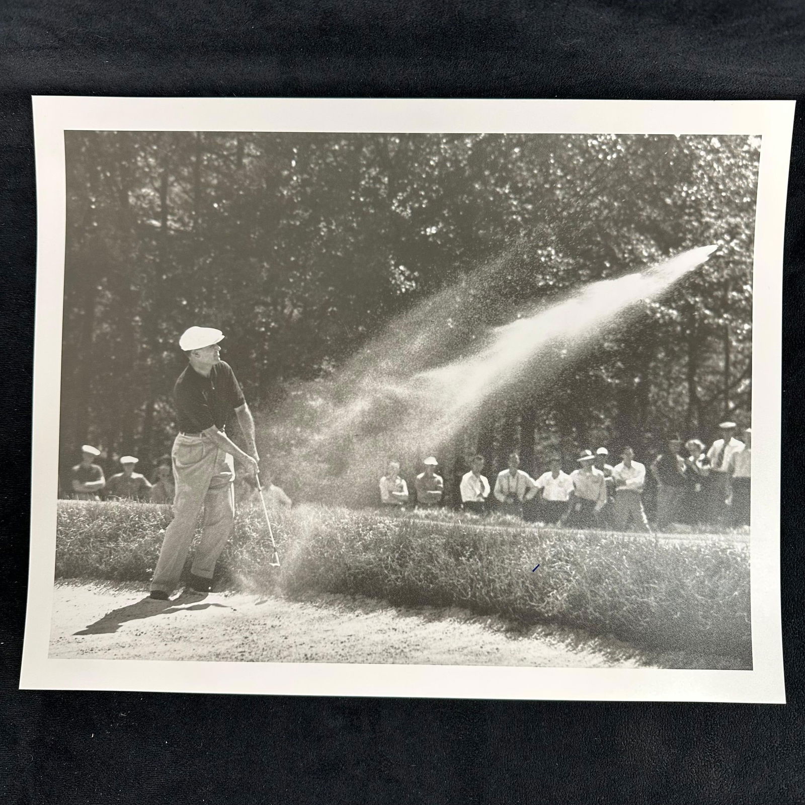 Ben Hogan Black and White Golf Action Analog Photo Print Golfer in Sand Trap Shot: Black and white vintage photograph capturing Ben Hogan, a professional golfer, mid-swing from a sand trap, with sand dramatically spraying across the frame. The action shot is enhanced by the