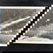 Ben Hogan Black and White Golf Action Analog Photo Print Golfer in Sand Trap Shot: Black and white vintage photograph capturing Ben Hogan, a professional golfer, mid-swing from a sand trap, with sand dramatically spraying across the frame. The action shot is enhanced by the