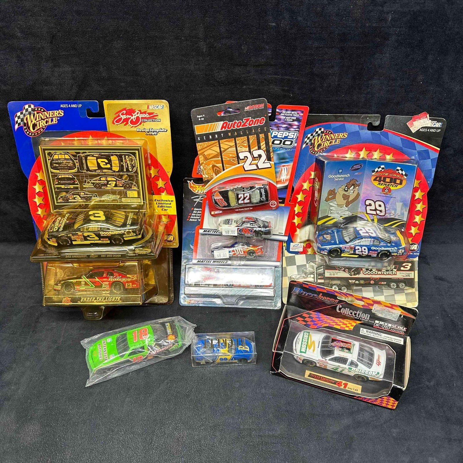 NASCAR Die Cast Car Replica Set Ten Vehicles Truck and Cars: Various collection of NASCAR stock car collectibles featuring (11) die cast cars. These collectibles are in like new condition never being removed from packaging. These items are in like new,