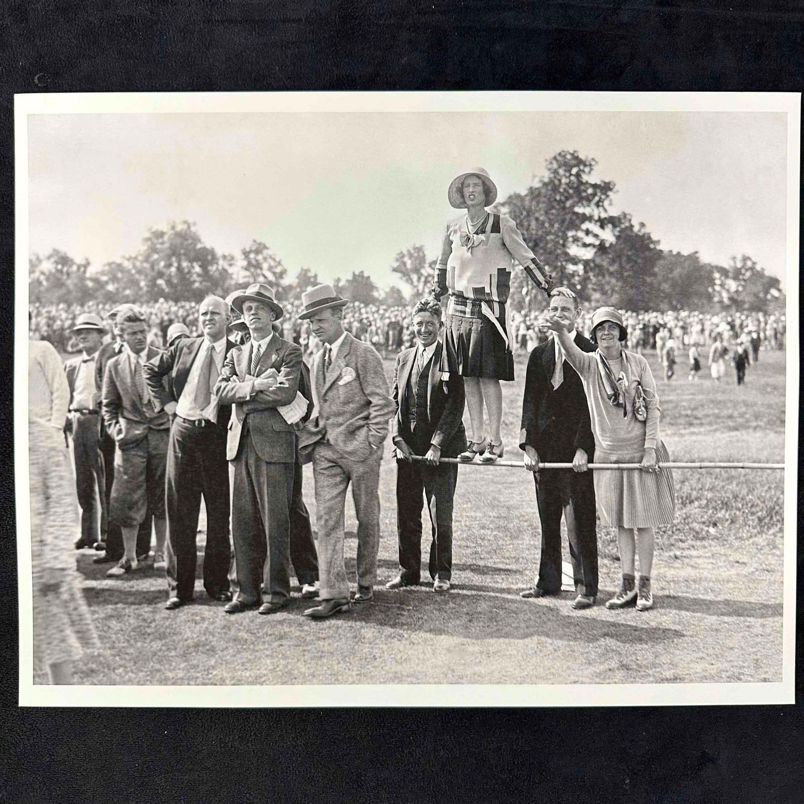 Golf Tournament Crowd Photograph Print Spectators on the Fence Black and White 14" x 11" B: Black and white vintage photograph showing a lively 1920's golf tournament crowd, with spectators dressed in classic period attire. One woman stands on a rail for a better view. This item is in