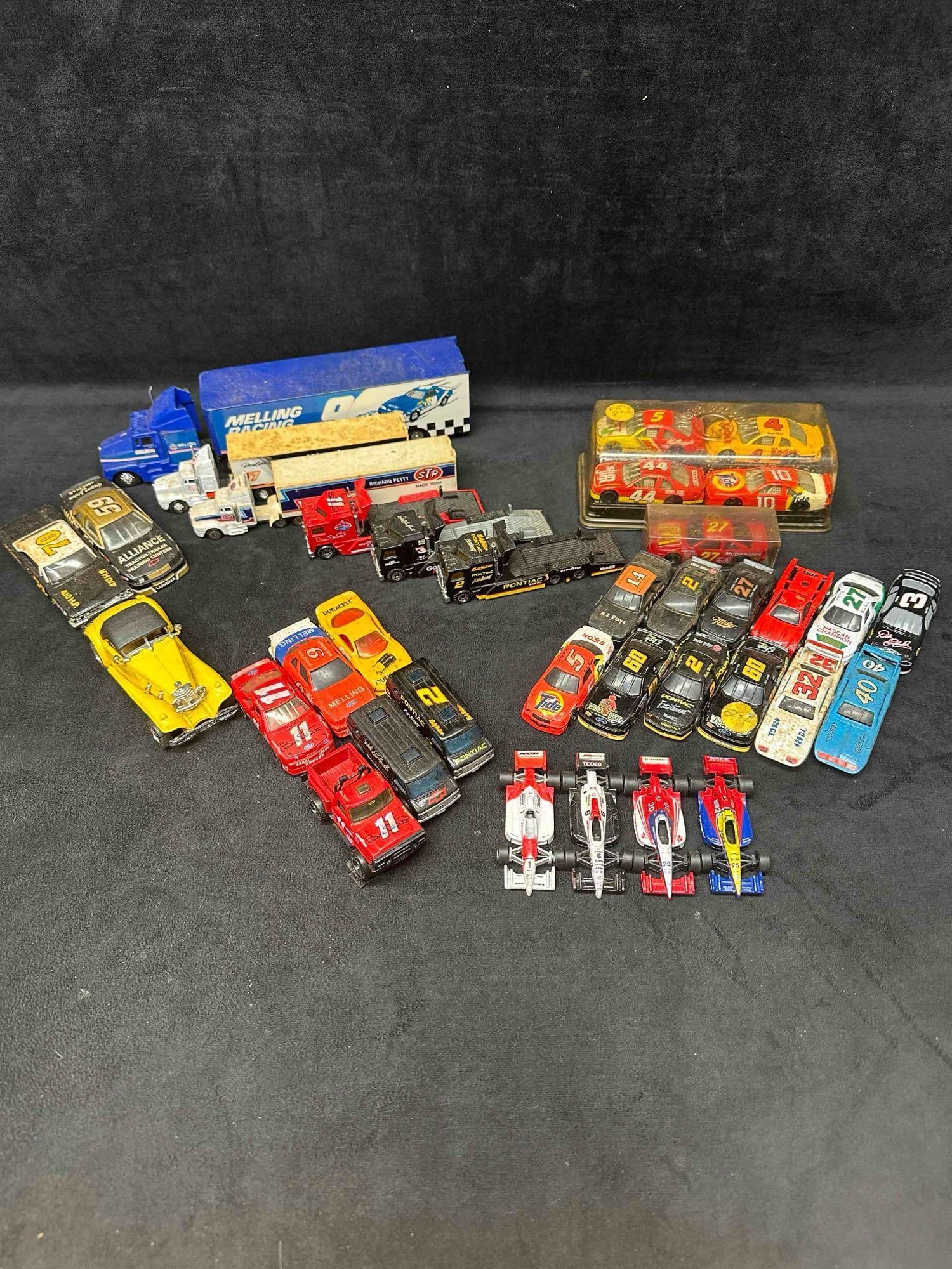 Die Cast NASCAR Truck Van Car Stock Vehicle Race Cars Set of Thirty Six: Die Cast NASCAR Truck Van Car Stock Vehicle Race Cars Set of Thirty Six. Several vintage NASCAR vehicles included with different scales and sizes. each vehicle showing signs of wear due to age and