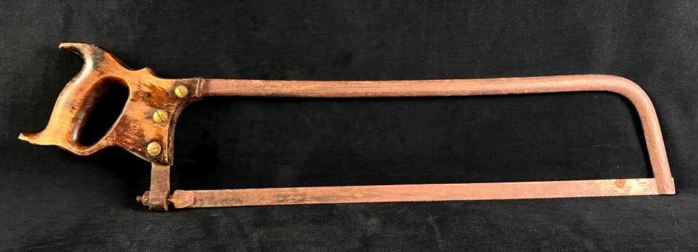 Antique Hand Saw: Antique Hand Saw Late 19th century hand saw, with wood handle and steel blade. This antique tool has an ergonomic hand-carved handle and a blade that is still quite sharp. The metal parts of the saw