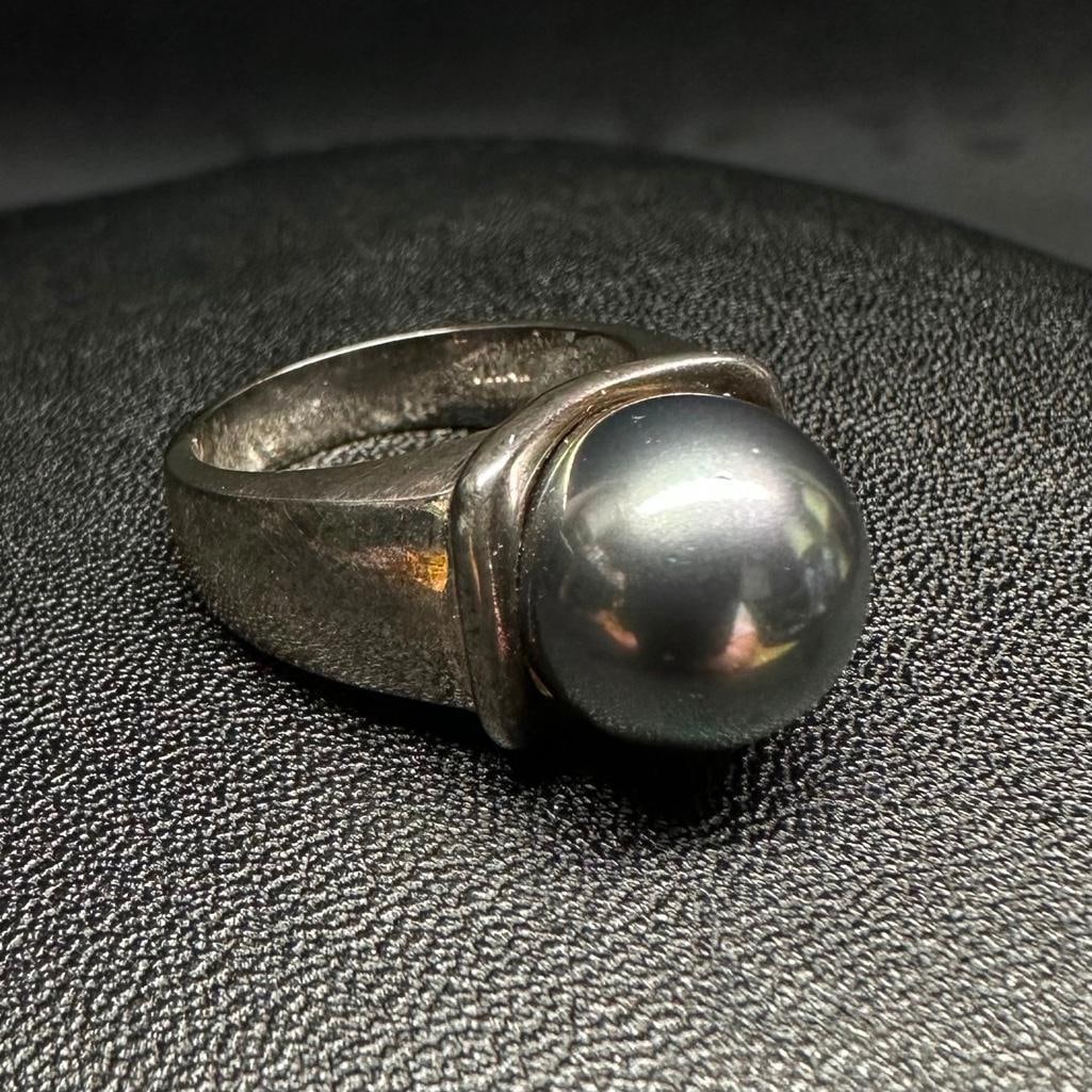 Sterling Simulated Pearl Ring: This piece of jewelry has been tested and researched prior to listing. Please view all our pictures they are part of our description. DETAILS: Metal - Sterling Silver Color - Silver Stones - Simulate