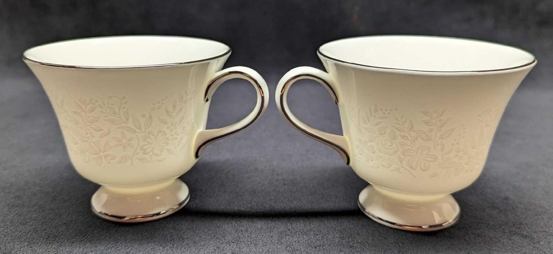 2 Wedgwood China Silver Ermine Contour Footed Cups C: 2 Wedgwood China Silver Ermine Contour Footed Cup C. This series was released from 1971 - 1993. Each cup is approx 4 1/2" x 3 1/2" x 3" and the total weight is 0.62 lbs. The footed cups