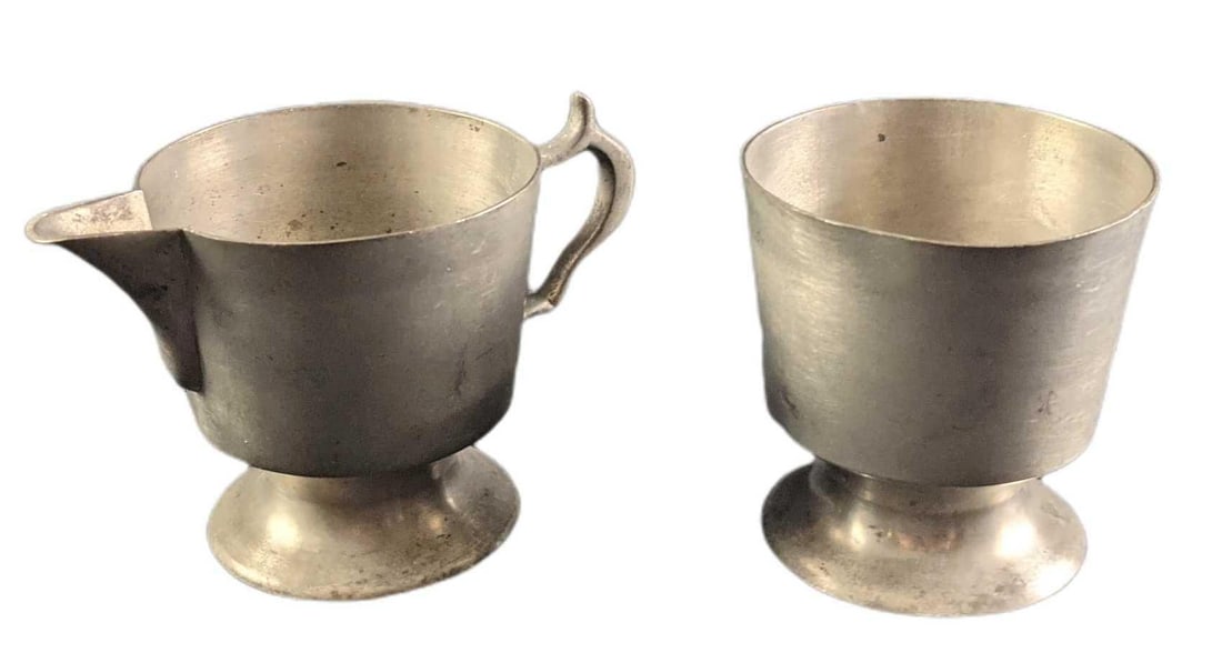 Vintage Woodbury Marked Pewter Creamer & Sugar Bowl: This lot comes with: (1) Pewter Sugar Bowl. This is approx 3 1/2" x 3 1/2" x 3 1/2". Has markings, scratches, and a couple of small dents. (1) Pewter Creamer. This is approx 6" x 3 1/