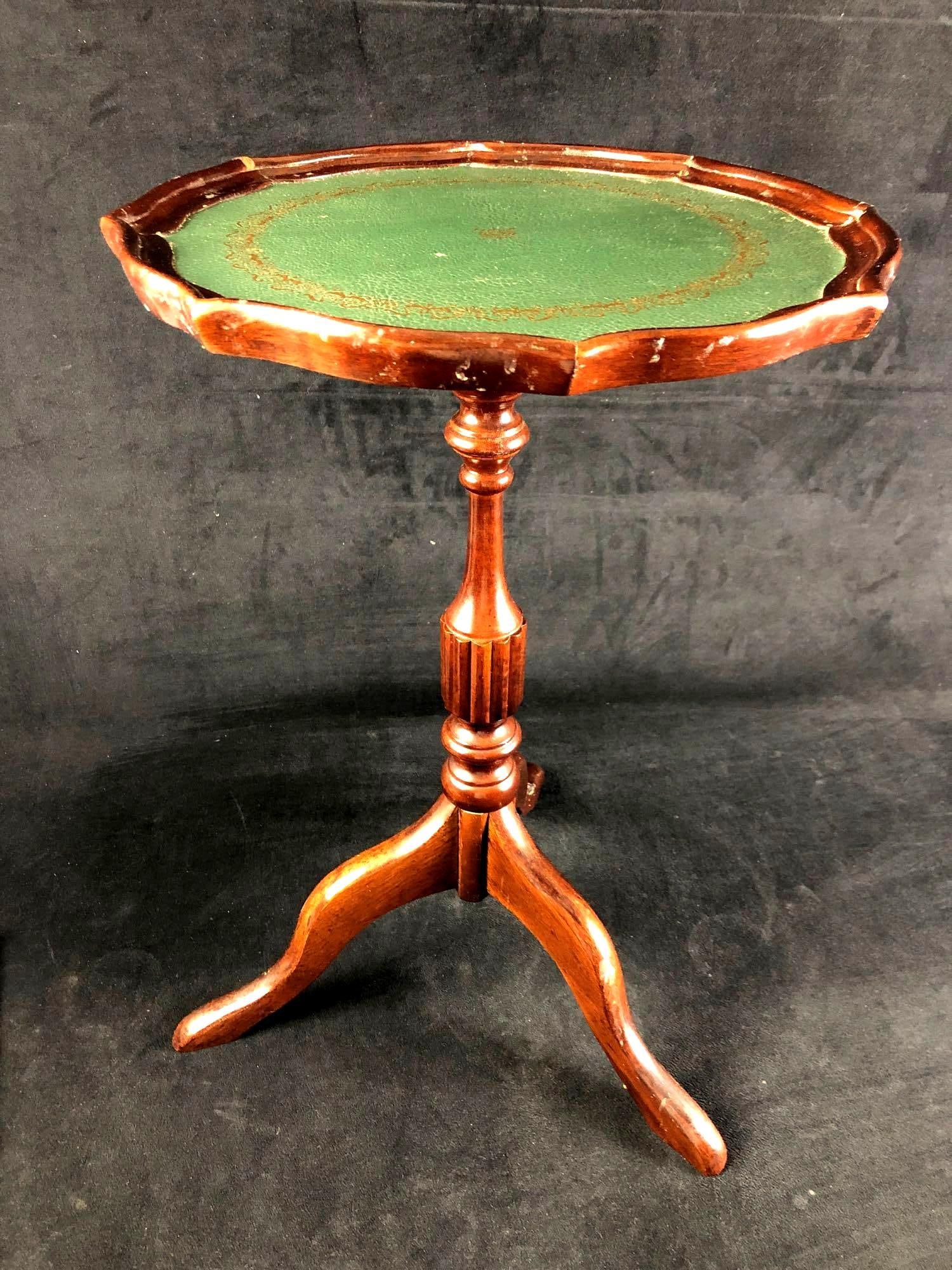 Small Bombay Wood Side Table: Small Bombay side table. Made in Malaysia. Found in a recent estate. Red in color with small green surface on the top. This auction includes: (1) Small Bombay Wood Side Table Condi
