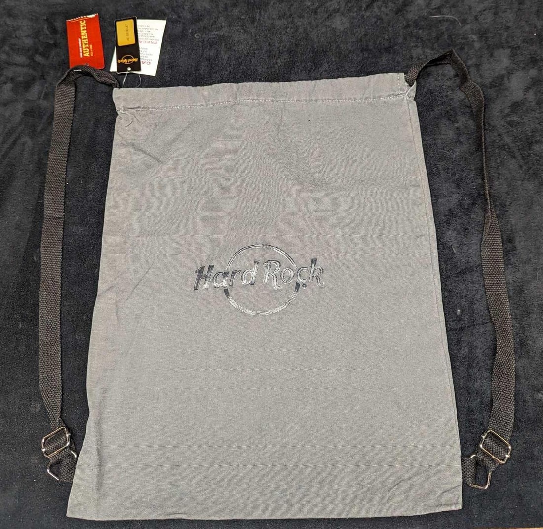 Hard Rock Cafe Sack Bag With Tags: Hard Rock Cafe Sack Bag With Tags. "Gray Souvenir Sack Bag." This is approx 13" x 16 1/2" and it weighs 0.25lb. Folded, the bag is approx 7" x 1" x 4". The bag has no known damage.