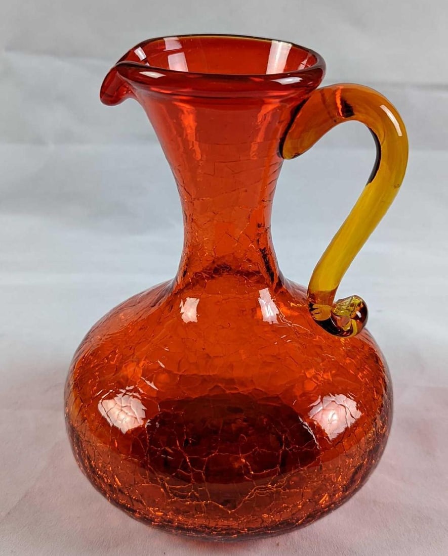 Vintage Red Crackle Glass Small Vase: Vintage Red Crackle Glass Small Pitcher/Vase. The maker is unknown. Is approx 4 1/2" x 4 1/4" x 6" and it weighs 1.01lb. The small pitcher is in a good, vintage condition with no chips or