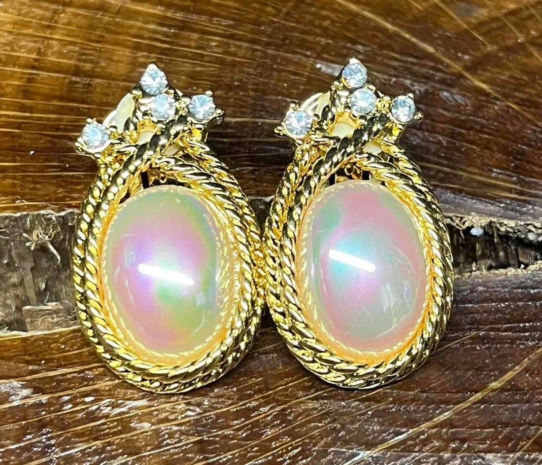 Nolan Miller Faux Pearl Rhinestone Gold Tone Clip On Earrings: This lot contains a Nolan Miller Faux Pearl Rhinestone Gold Tone Clip On Earrings. The earrings are one size fits all and they fit in a small 3 1/2" x 2 1/4" plastic bag. Total weight is 0.6oz. Overal