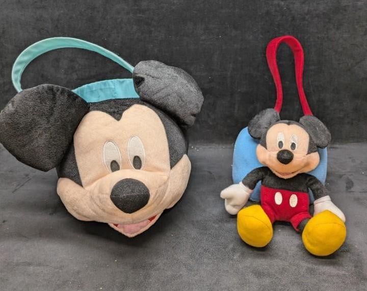 2 Disney Mickey Mouse Plush Baskets: 2 Disney Mickey Mouse Plush Baskets. This lot includes: (1) Mickey Mouse Plush Face Basket. This is approx 13" x 16" x 15". There are some marks inside the bucket. (1) Mickey Mouse Plush