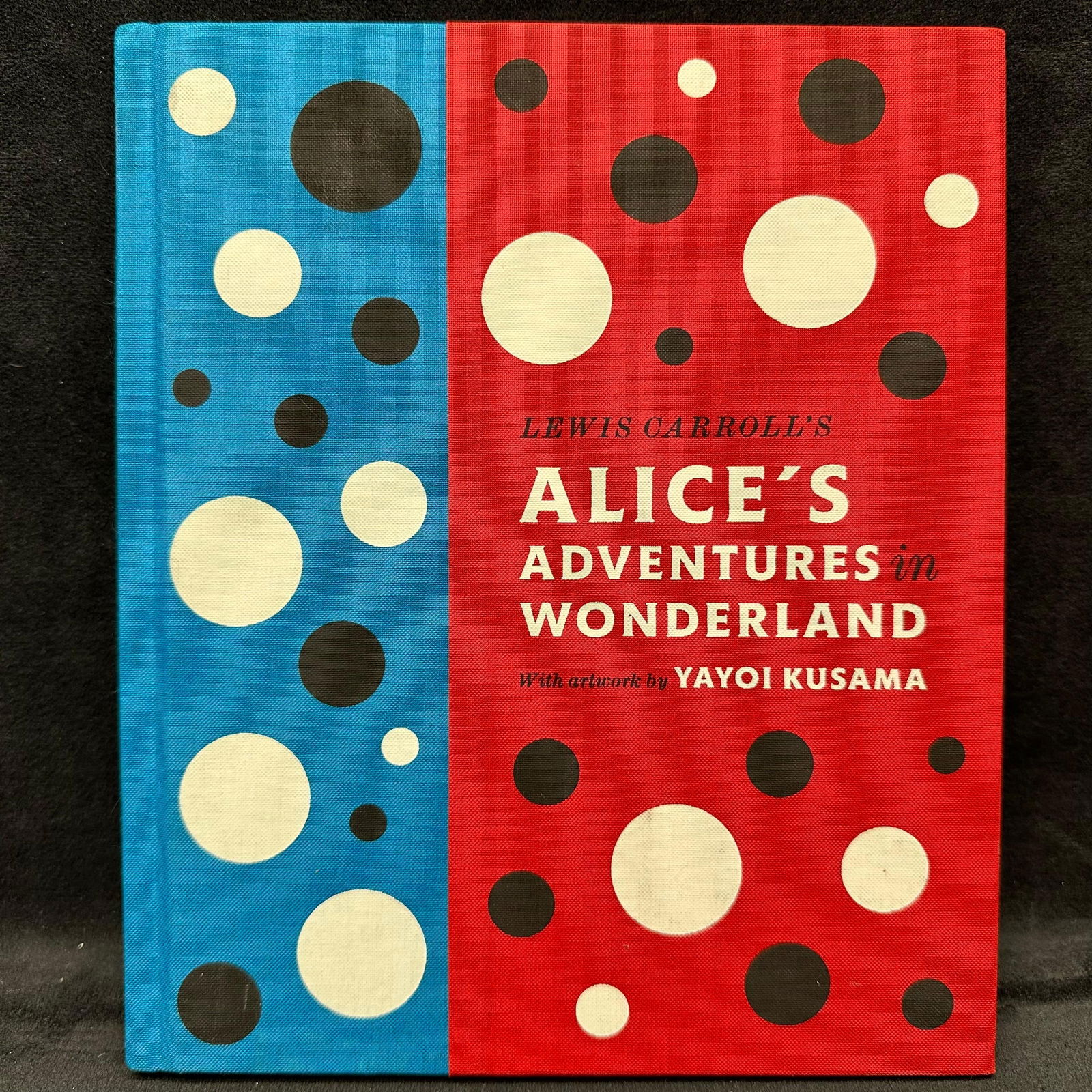 Lewis Carroll's Alice's Adventures in Wonderland With Artwork by Yayoi Kusama Hardcover Book: Book cover and pages in good condition, appears to be lightly read. This item is in pre-owned, previously displayed condition, with light wear and surface scratches. Please reference all photos for fu