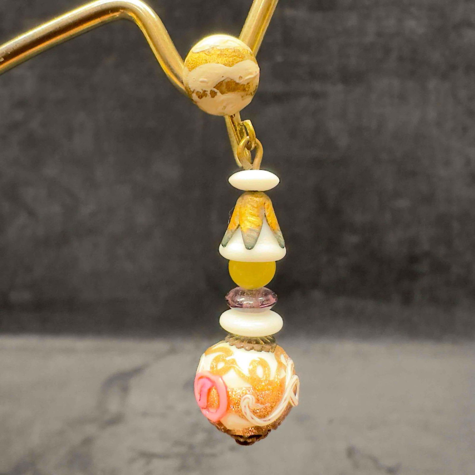 Murano Art Glass Venetian Lamp Work White Copper Accents Pink Floral Beaded Drop Earrings F44: Murano Art Glass Venetian Lamp Work White Copper Accents Pink Floral Beaded Drop Earrings F44. Earrings with white glass beads with beautiful designs on each. The earrings feature pink floral, yellow