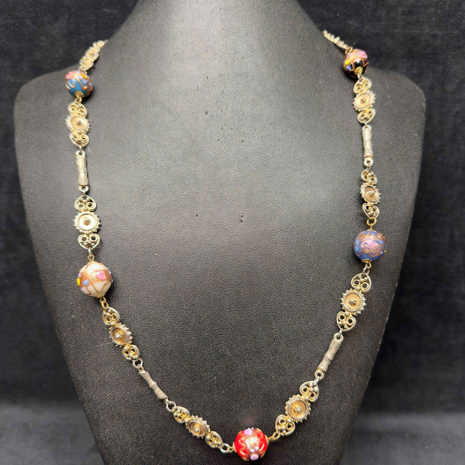 Venetian Murano Art Glass Lamp Work Multi Colored Round Beaded Unique Chain Design Necklace D16: Venetian Murano Art Glass Lamp Work Multi Colored Round Beaded Unique Chain Design Necklace D16. Necklace with multi colored glass beads with beautiful designs on each. The necklace features a uniquel