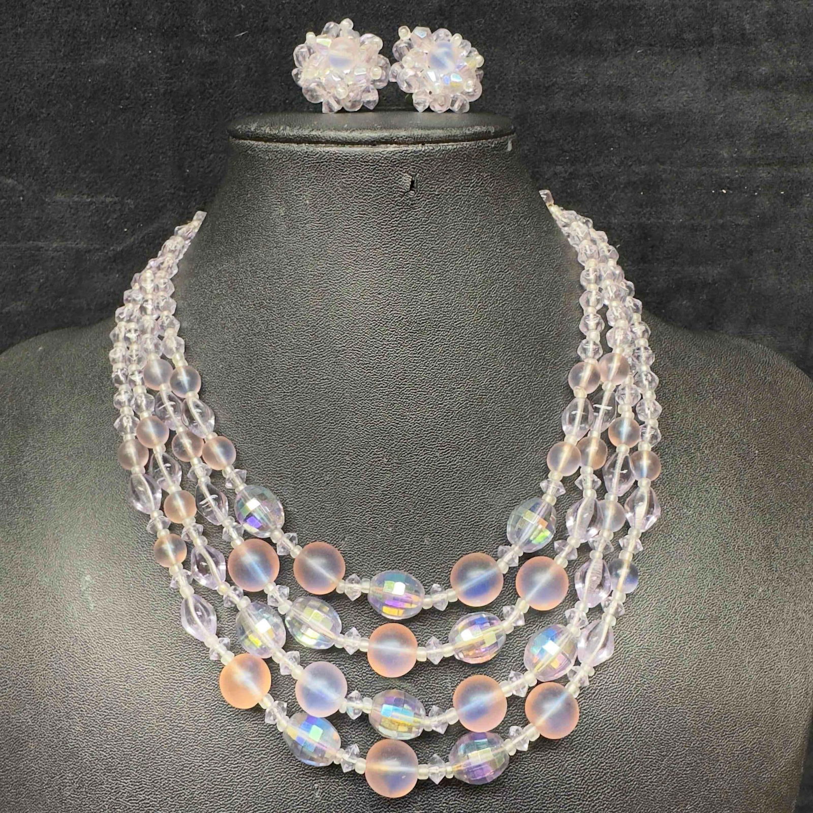 Vintage Germany Four Strand Purple Art Glass Beaded Necklace and Earrings Costume Jewelry: Vintage Germany Four Strand Purple Art Glass Beaded Necklace and Earrings Costume Jewelry. Four strand necklace and earrings with clear purple colored glass beads with beautiful designs on each. The