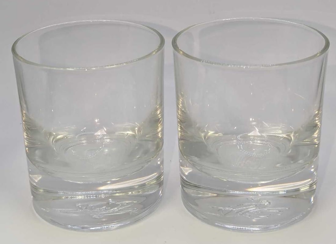 2 Vintage Crown Royal Whiskey Glasses: 2 Vintage Crown Royal Whiskey Glasses. Both the glasses have the Crown On Pillow logo on the bottom. Each heavy glass is approx 2 7/8" x 2 7/8" x 3 1/2" and the total weight is 1.74lb. The glasses