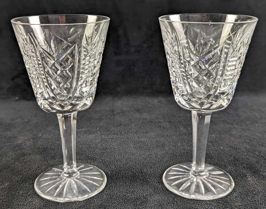 Two Retired Waterford Crystal Clare Cut Goblets: Two Retired Waterford Crystal Clare Cut Goblets. This design was released from 2000 to 2017. Each goblet is approx 3" x 3" x 5 3/4" and together they weigh 1.78lb. The goblets are in a good, unused co