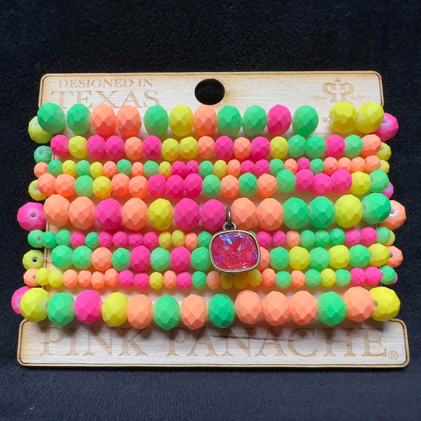Nine 9 Strand Beaded Bracelet Set Pink Panache Light Bright Colors: Nine 9 Strand Beaded Bracelet Set Pink Panache Light Bright Colors. Nine bracelet set with light bright orange, green, pink, and yellow colored beads. The bracelets are new with original packaging. Th