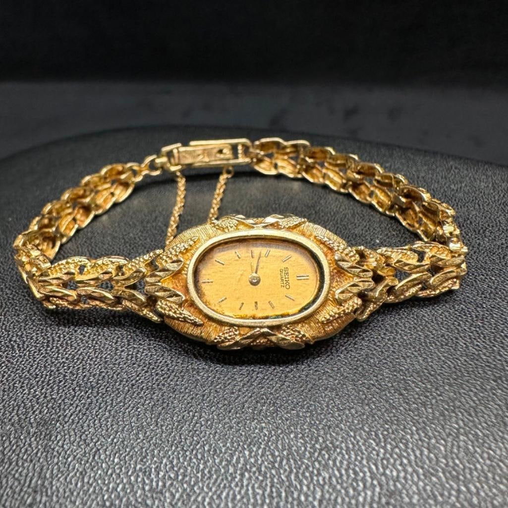 Ornate 14k Gold Ladies Seiko Quartz Watch: This piece of jewelry has been tested and researched prior to listing. Please view all our pictures they are part of our description. DETAILS: Metal - 14k GoldColor - Yellow/GoldStones - noneMovement