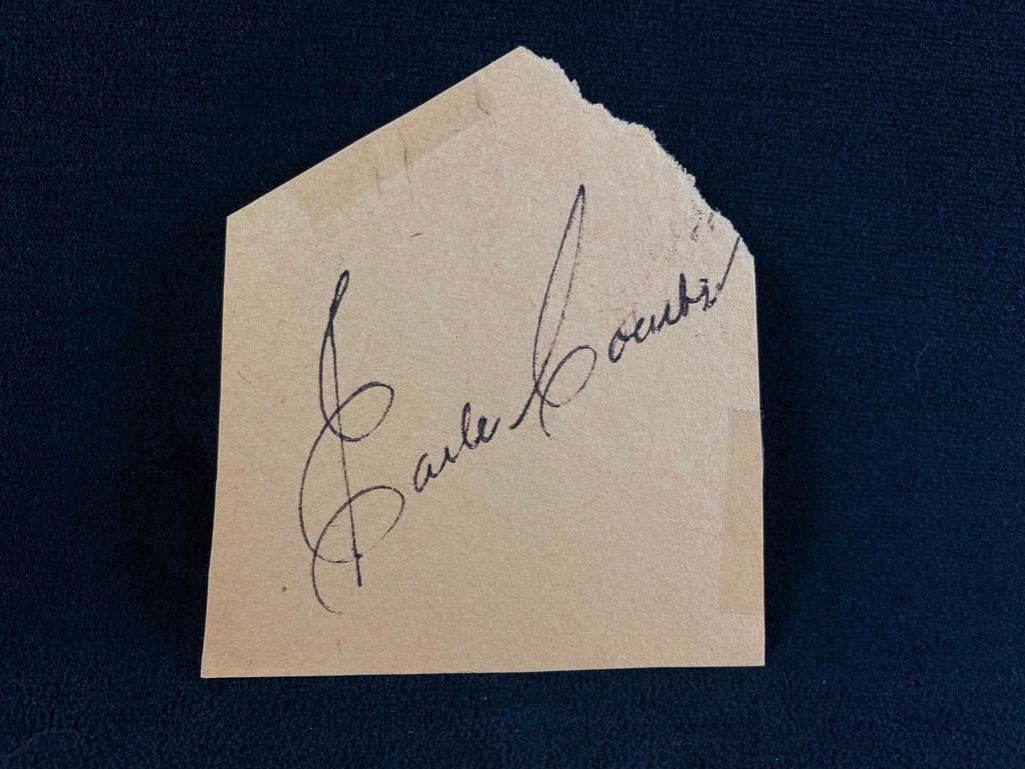 Cut, Signed Earle Combs: Cut, Signed Earle Combs Cut piece of paper, signed Earle Combs. Does not have COA and has not been authenticated but appears to be signed by the famous Yankee player who was a part of the