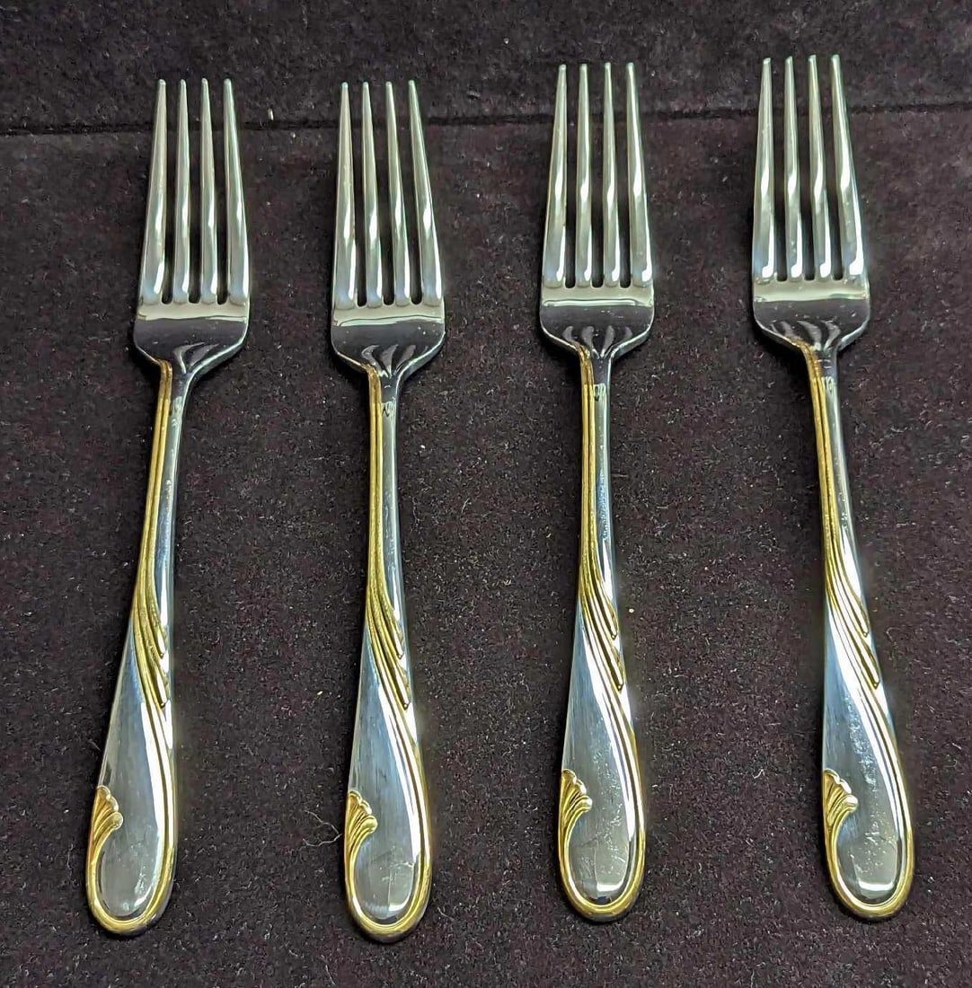 4 Retired Gorham Golden Swirl Oval Dinner Forks B: 4 Retired Gorham Golden Swirl Dinner Forks B. This series was released by Gorham Silver from the year 1982 to the year 2001. These stainless steel forks have signs of light wear with markings and