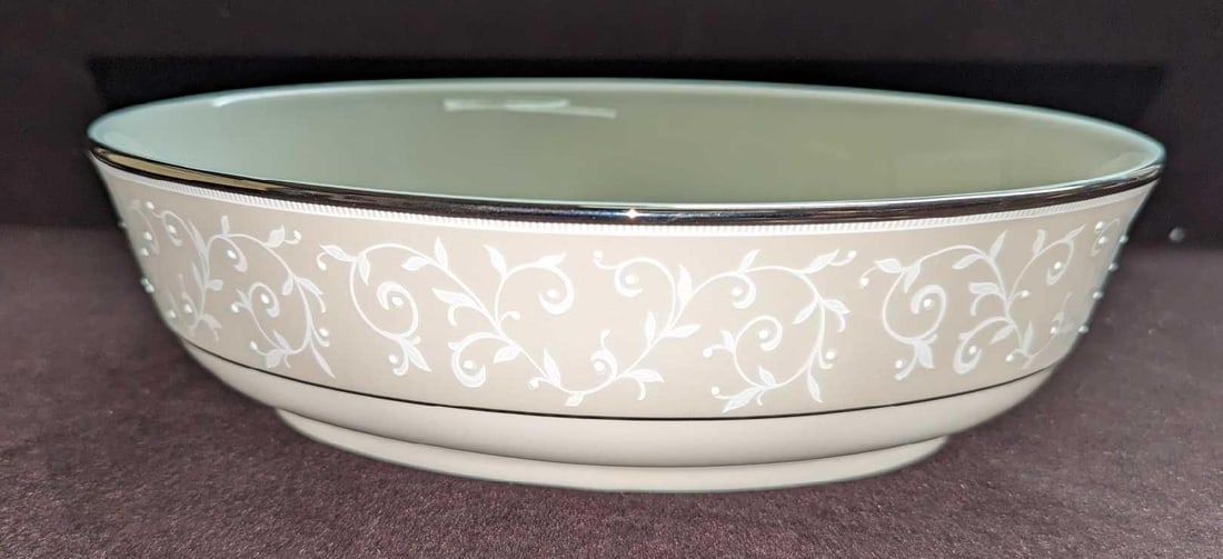 Lenox Opal Innocence 9" Open Vegetable Bowl: Lenox Opal Innocence 9" Open Vegetable Bowl. Made of China. The bowl is approx 9 3/4" x 7" x 2 7/8". The Underplate is approximately 8 1/2" x 6" x 3/4". It comes in its original box that is
