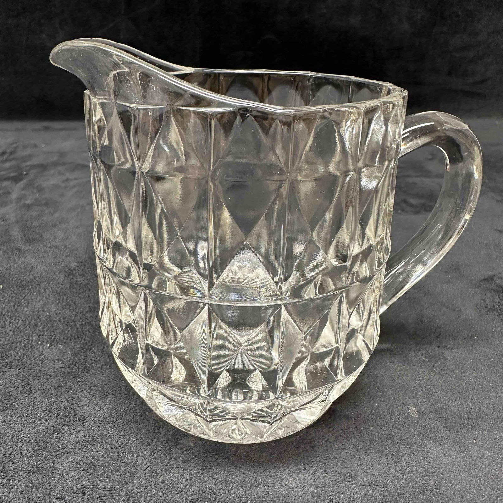 1930's Jeanette Glass 16oz Mini Pitcher Windsor Diamond Farmhouse Country Style Creamer: Vintage mini pitcher with diamond cut pattern and starbusrt bottom base design. No chips, cracks, or breaks in the glass. This item is in good pre-owned, previously displayed condition with light