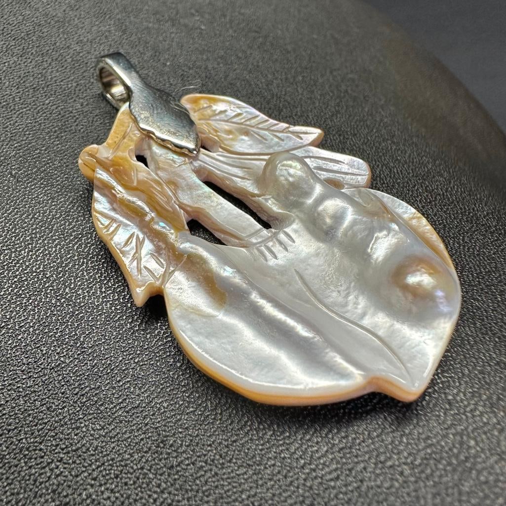 Hand-Carved Blister Pearl Pendant - Plant: This piece of jewelry has been tested and researched prior to listing. Please view all our pictures they are part of our description. DETAILS: Metal - Base MetalColor - SilverStones - Blister Pearls