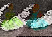 2 Vintage Josef Originals Ceramic Girl Figurines August And Blue Dress: 2 Vintage Josef Originals Ceramic Girl Figurines August And Blue Dress. This lot includes: (1) August Birthday Girl. This is approx 4 1/4" x 3 5/8" x 3 1/4". (1) Blue Dress Girl. This is