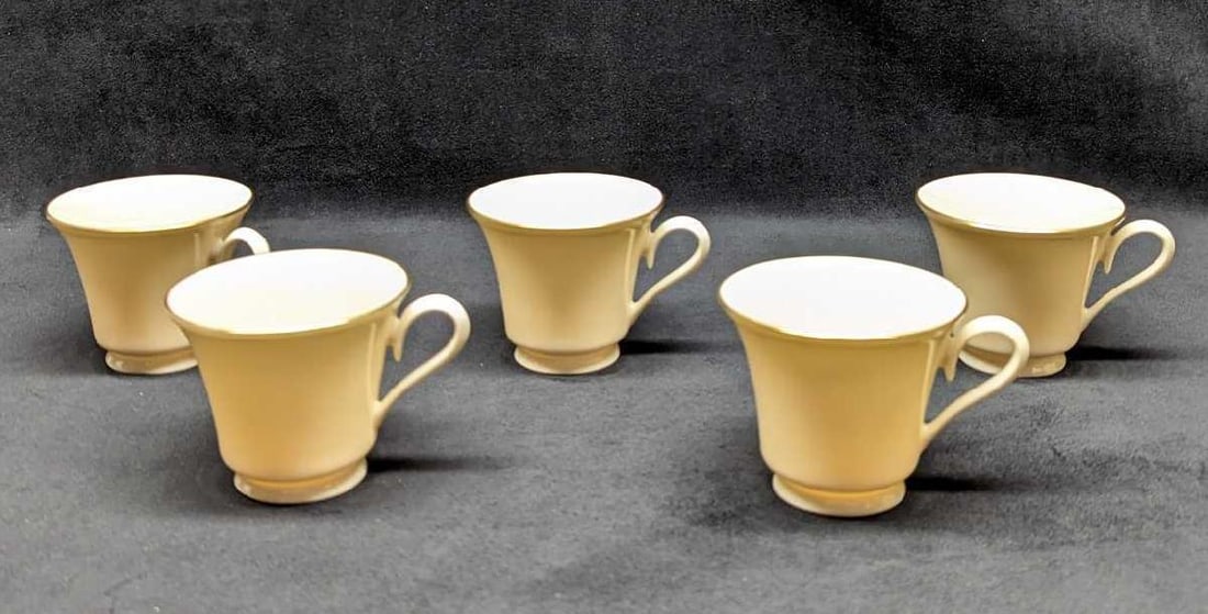 5 Lenox Special Bone China Cups: 5 Lenox Special Bone China Cups. Has 24K Gold Trim. Each cup is approx 4 1/2" x 3 1/2" x 3" and the total weight is 1.51lb. One of the cups has a very small brown dot on the bottom.