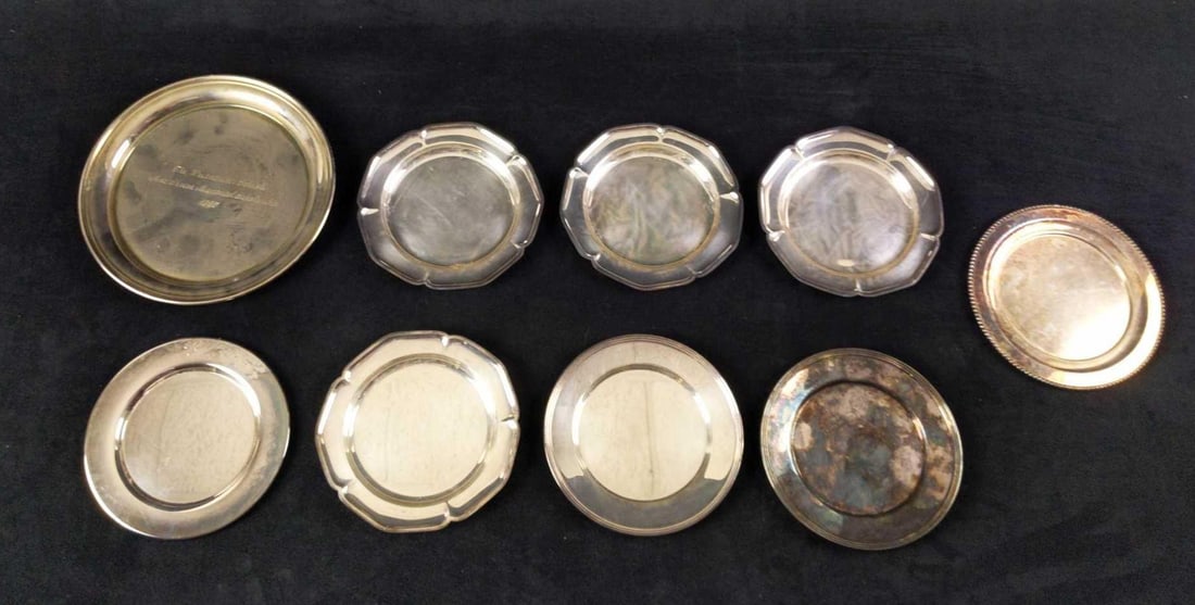 Nine Asst Vintage Silverplated Small Plates: This lot includes: (2) FB Rogers Silverplated Bread Plate. 1025. Plate is approx 6" across. (1) Meriden Silverplated 344 Bread Plate. Is approx 6" across. (1) VM Rogers Silverplated Bread Pla