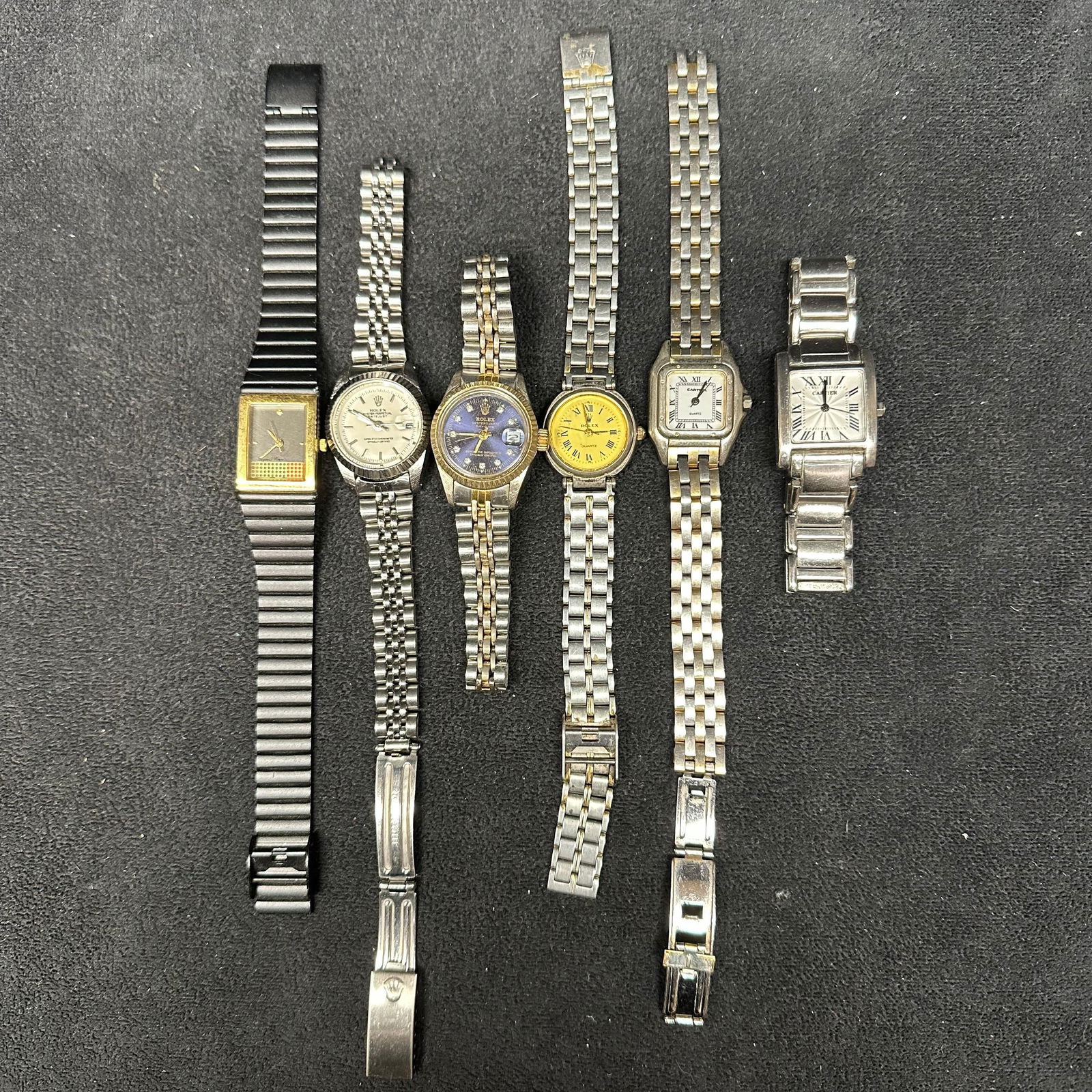 Designer Inspired Wristwatch Lot Mixed Watch Styles Quartz Movements: A group of designer-inspired wristwatches in assorted styles and finishes. Includes rectangular and round cases with metal link bracelets in silver-tone and two-tone appearances. All watches appear to