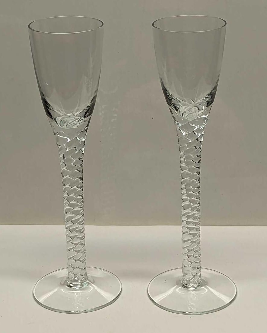 Two Vintage Twist Cordial Glasses: Two Vintage Twist Cordial Glasses. Its maker and date of creation are unknown. Each glass is approx 2" x 2" x 6 1/2" and the total weight is 0.35lb. The glasses are in a good, vintage condition with
