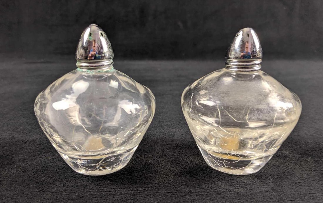 Vintage IW Rice Company Salt And Pepper Shaker: Vintage salt and pepper shakers by Japanese company, I.W. Rice Company. Salt & Pepper shakers are in good, vintage condition with a light tarnishing on one of the shaker tops. Crackle glass is
