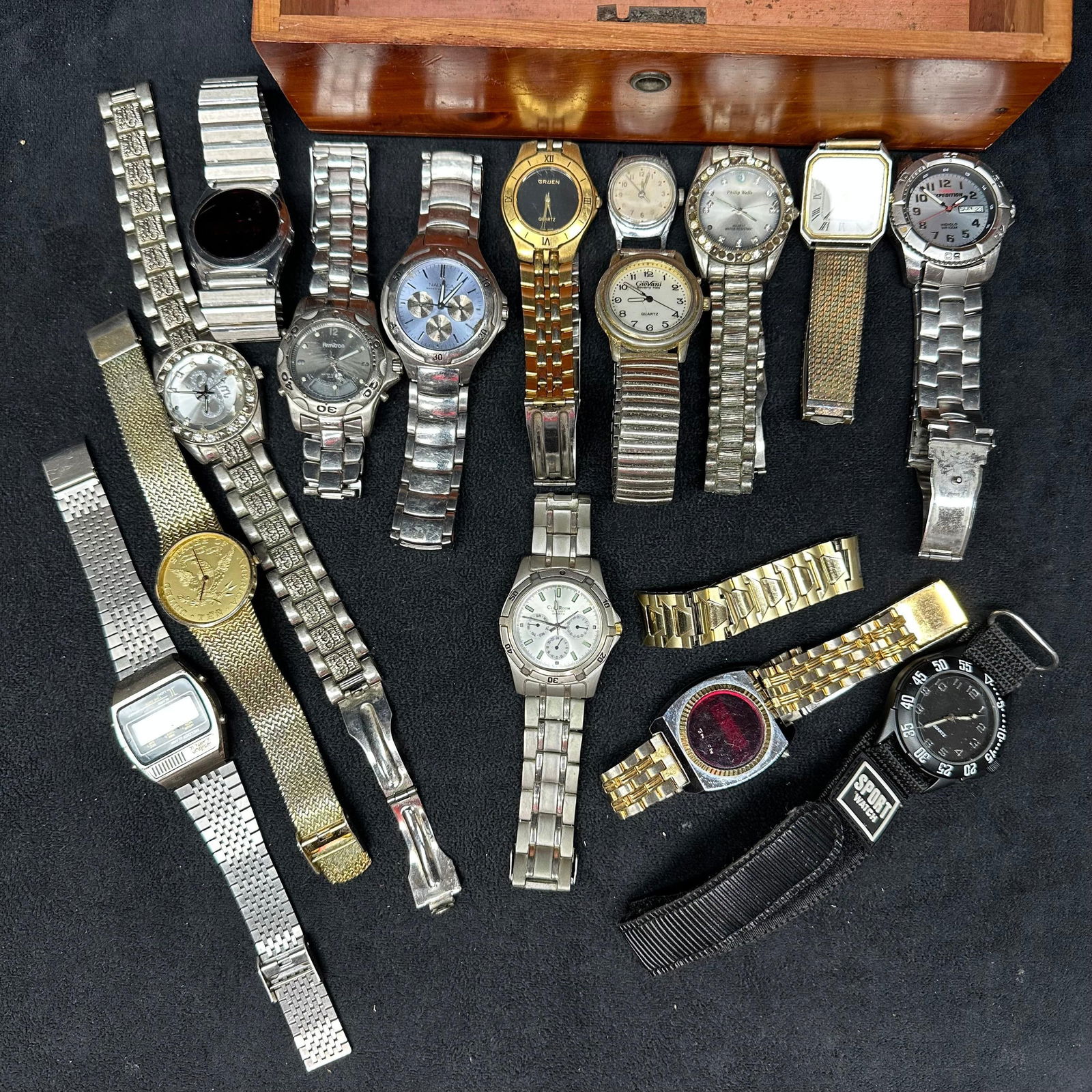 Assorted Wristwatch Lot with Wooden Watch Box of Vintage Watches: A group of assorted wristwatches, including quartz and digital examples in stainless steel and gold/silver-tone finishes. The lot includes a variety of men’s and women’s watches with metal bracele