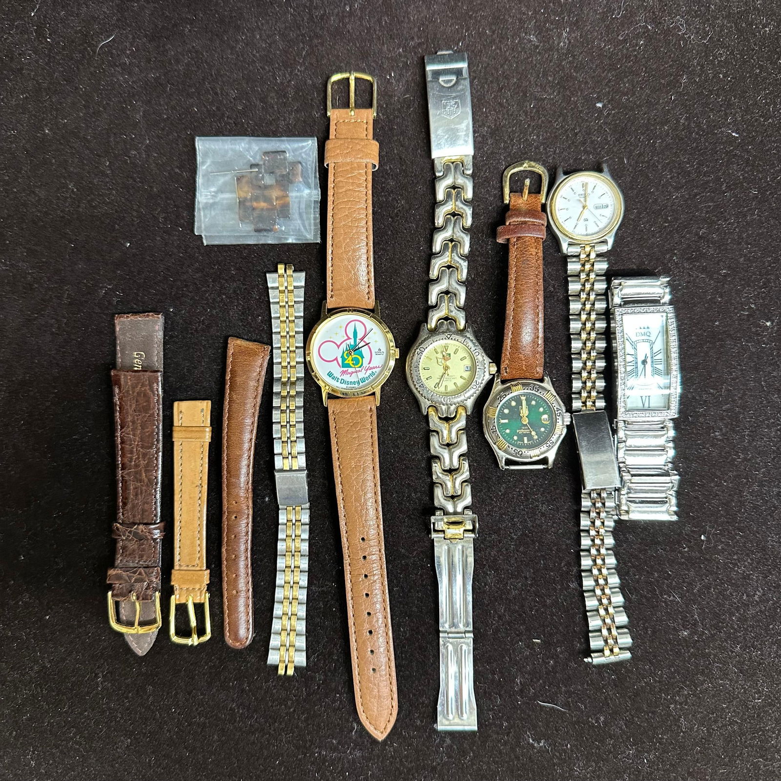 Group Lot of Vintage Wristwatches Watch Bands and Replacement Links: Mixed group of wristwatches, metal bracelets, leather watch bands, and assorted replacement links. Includes multiple wristwatches with leather and metal bands, additional loose metal bracelets, extra