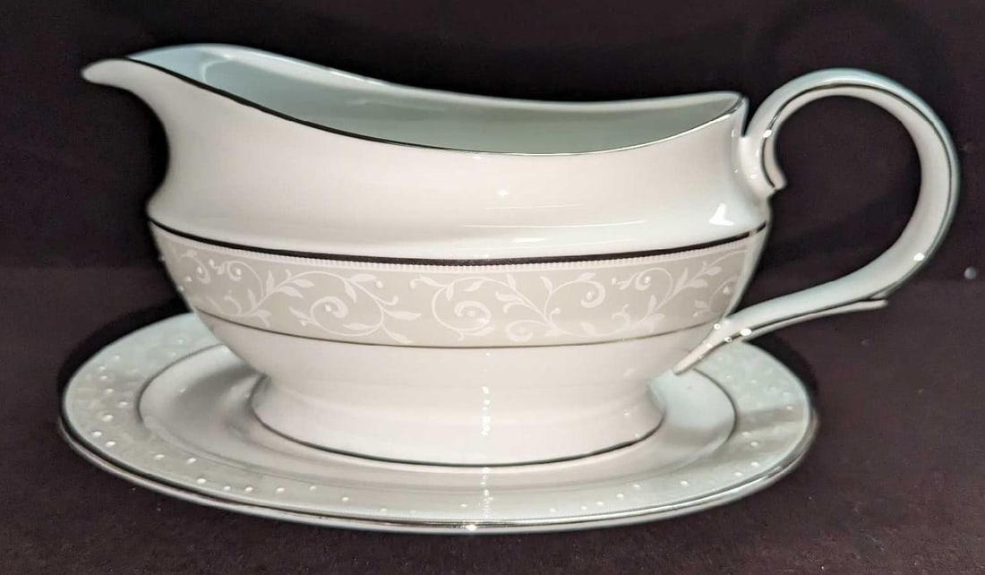 Lenox Opal Innocence Gravy Boat & Underplate: Lenox Opal Innocence Gravy Boat & Underplate. Made of China. The gravy boat is approx 9" x 3" x 4 1/8". The Underplate is approx 8 1/2" x 6" x 3/4". It comes in its original box that is approximately