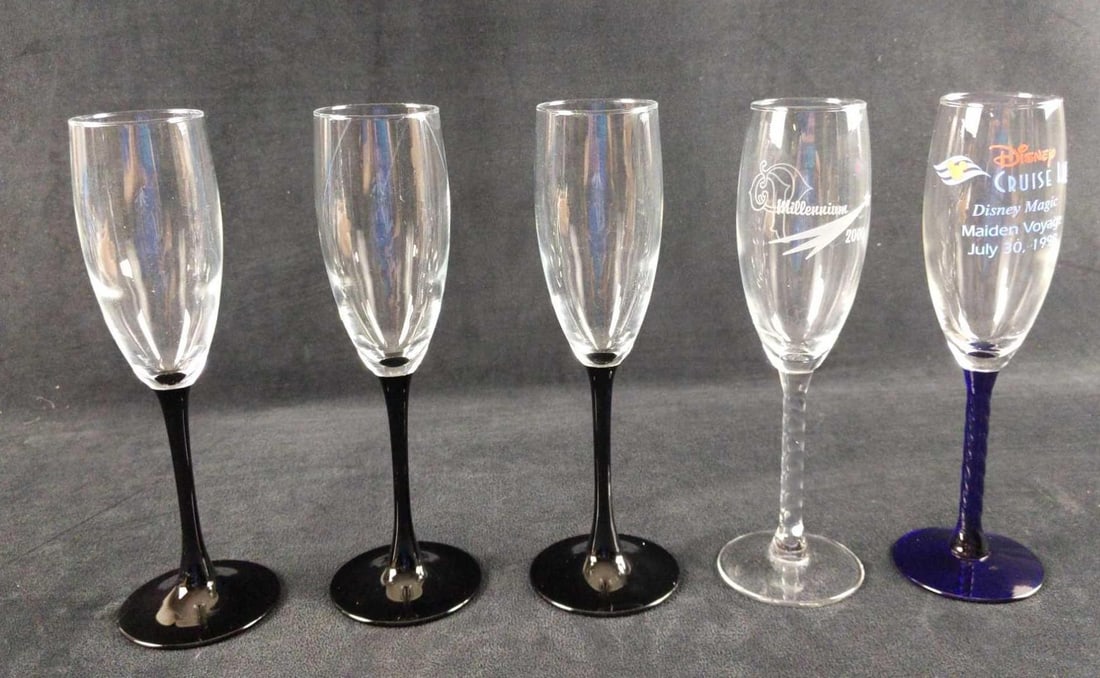 Champagne Flute Disney Cruise Year 2000: This lot includes: (3) Domino Luminarc Champagne Flutes. Made in France. These are approx 2" x 2" x 8 1/2". (1) Disney Cruise-Line Disney Magic Maiden Voyage 1998 Champagne Flute. This is