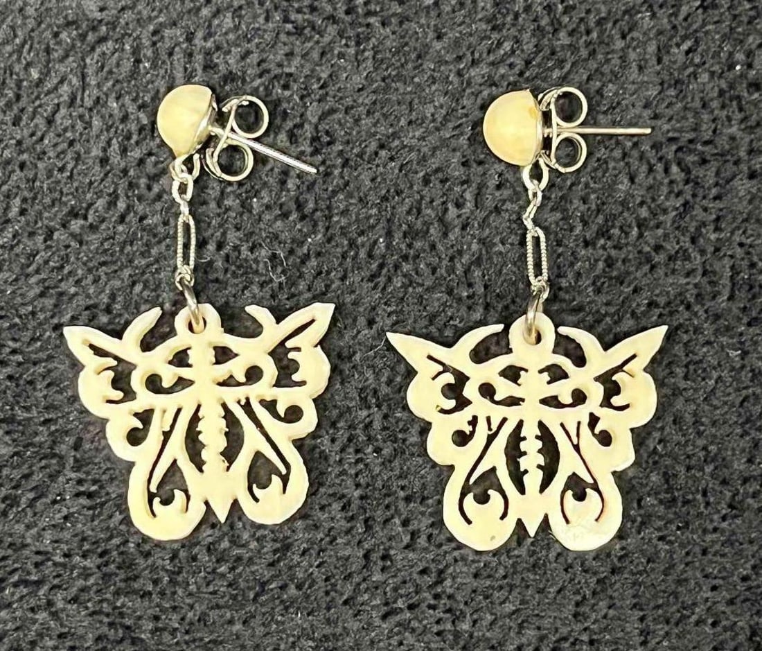 Hand Carved Bone Butterfly Dangle Earrings: This lot contains Hand Carved Bone Butterfly Drangle Earrings. Each earring is approx 1 1/4" x 3/4" x 1/4". Total weight is less than 1 gram. Overall the Hand Carved Bone Butterfly Drangle Earrings