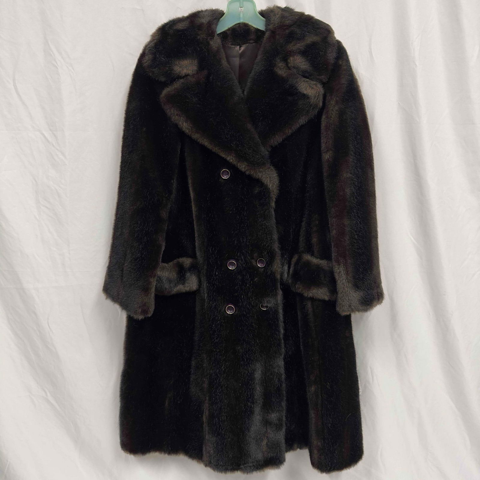 Esprit by North Bay Black Faux Fur Long Trent Coat Style: Esprit by North Bay Black Faux Fur Long Trent Coat Style. This coat features two exterior pockets, three button closures, three buttons for presentation, and two rope belt loops on the either side