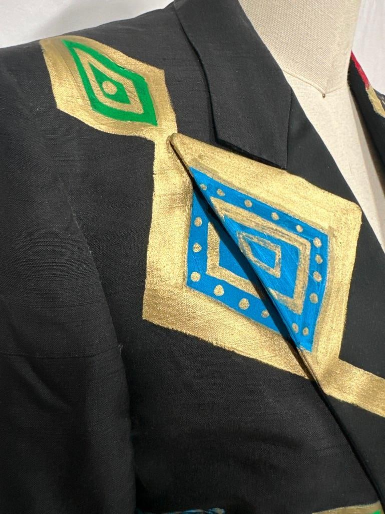 Hand-Painted Mardi Gras Jacket By Jon Planas: Mardi Gras parade jacket by Cafra Milano, custom hand-painted for the Krewe of Cork 2008 celebration by Jon Planas. Features vibrant Egyptian-style motifs with bold gold, red, green, and blue geometri