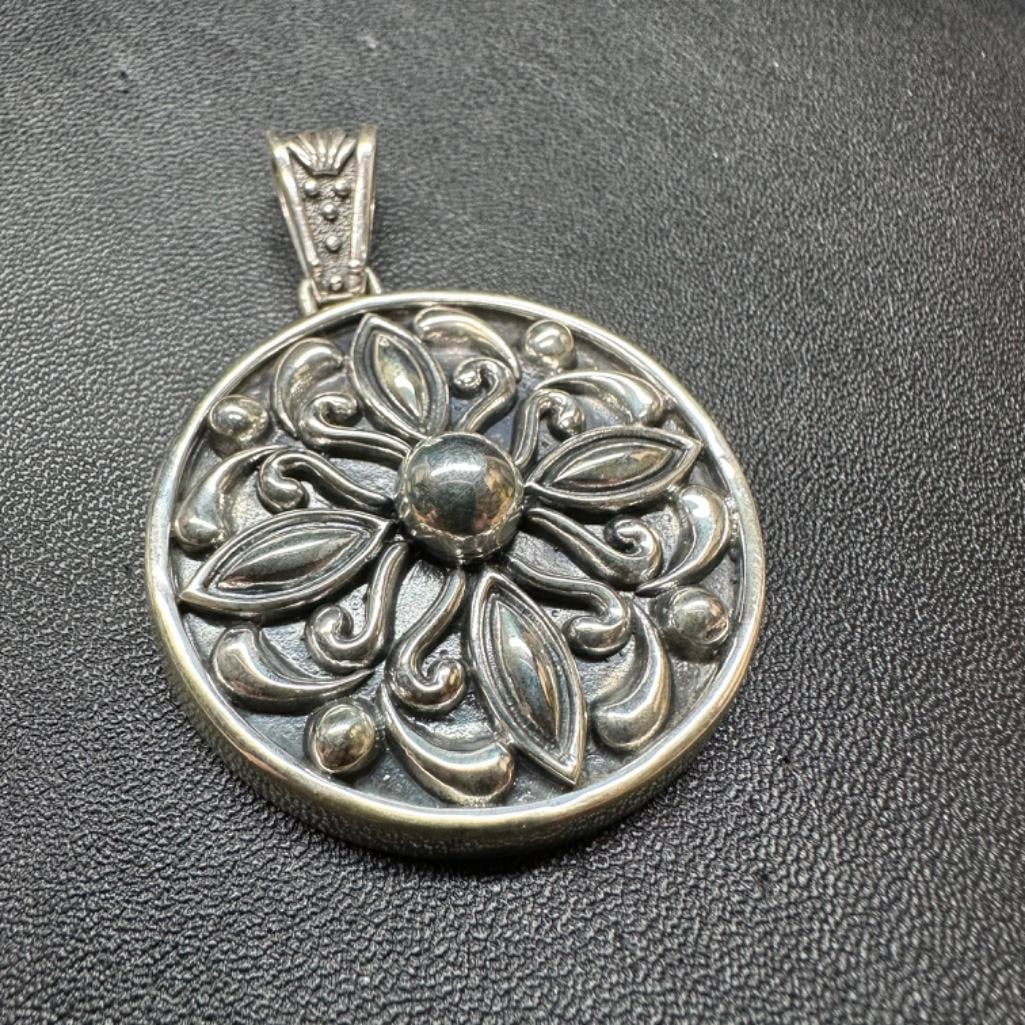 Round Ornate Sterling Pendant: This piece of jewelry has been tested and researched prior to listing. Please view all our pictures they are part of our description. DETAILS: Metal - Sterling Silver Color - Silver Stones - none Hal