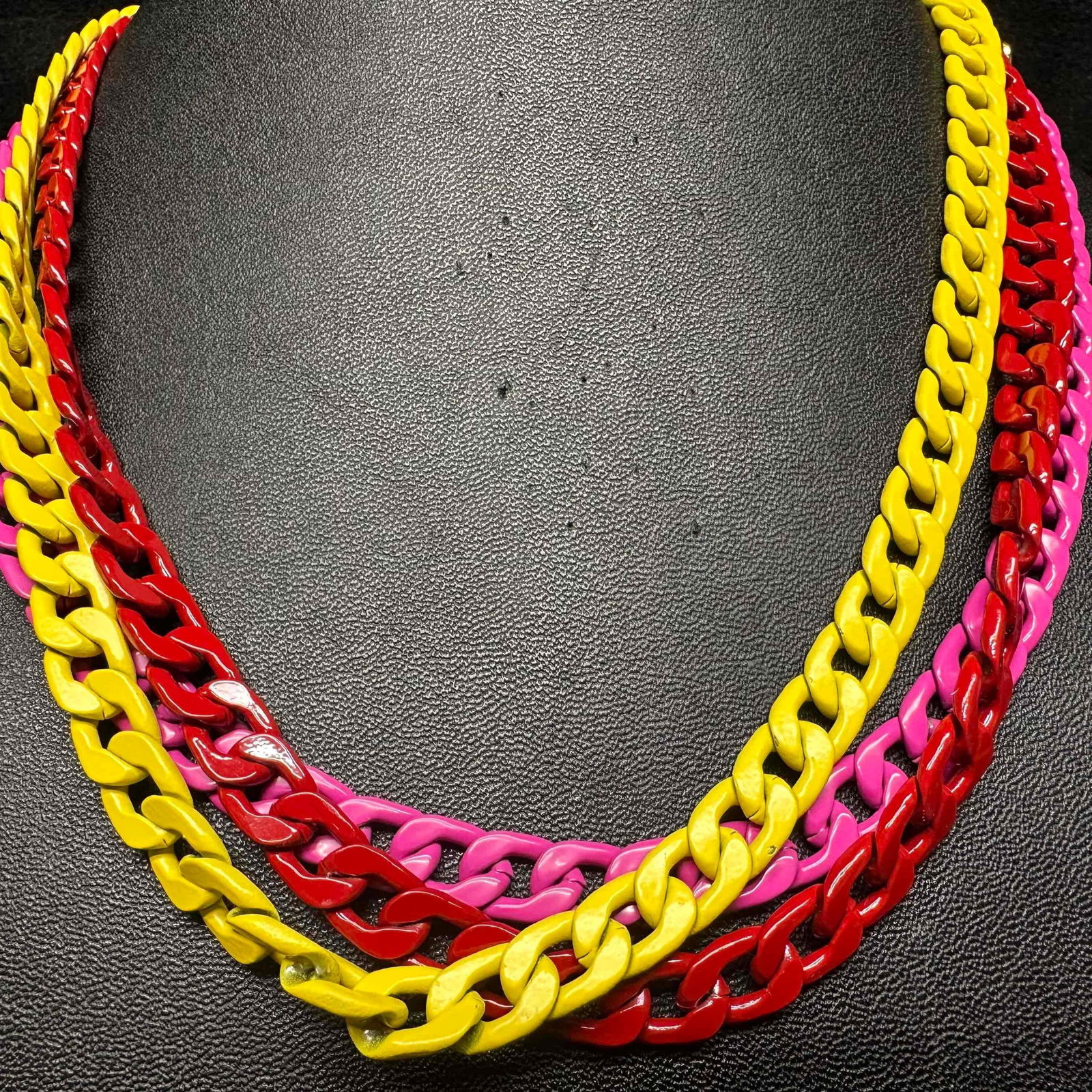 Melania Clara and Alexa Rae Multi Colored Chain Necklace Set: This Alexa Rae and Melania Clara necklace set features a magnet clasp closure. The necklaces have magnet extender clasp closures. Each necklace showcase modernist designs with gold toned chain accents