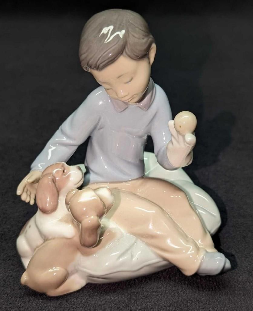 Retired Lladro Growing Up Together Figurine Puppies: Retired Lladro Growing Up Together Figurine Puppies. This was designed by Jose Javier Malavia and was released from the year 2003 to the year 2010. The figurine is approx 5" x 4" x 4 3/4" and it