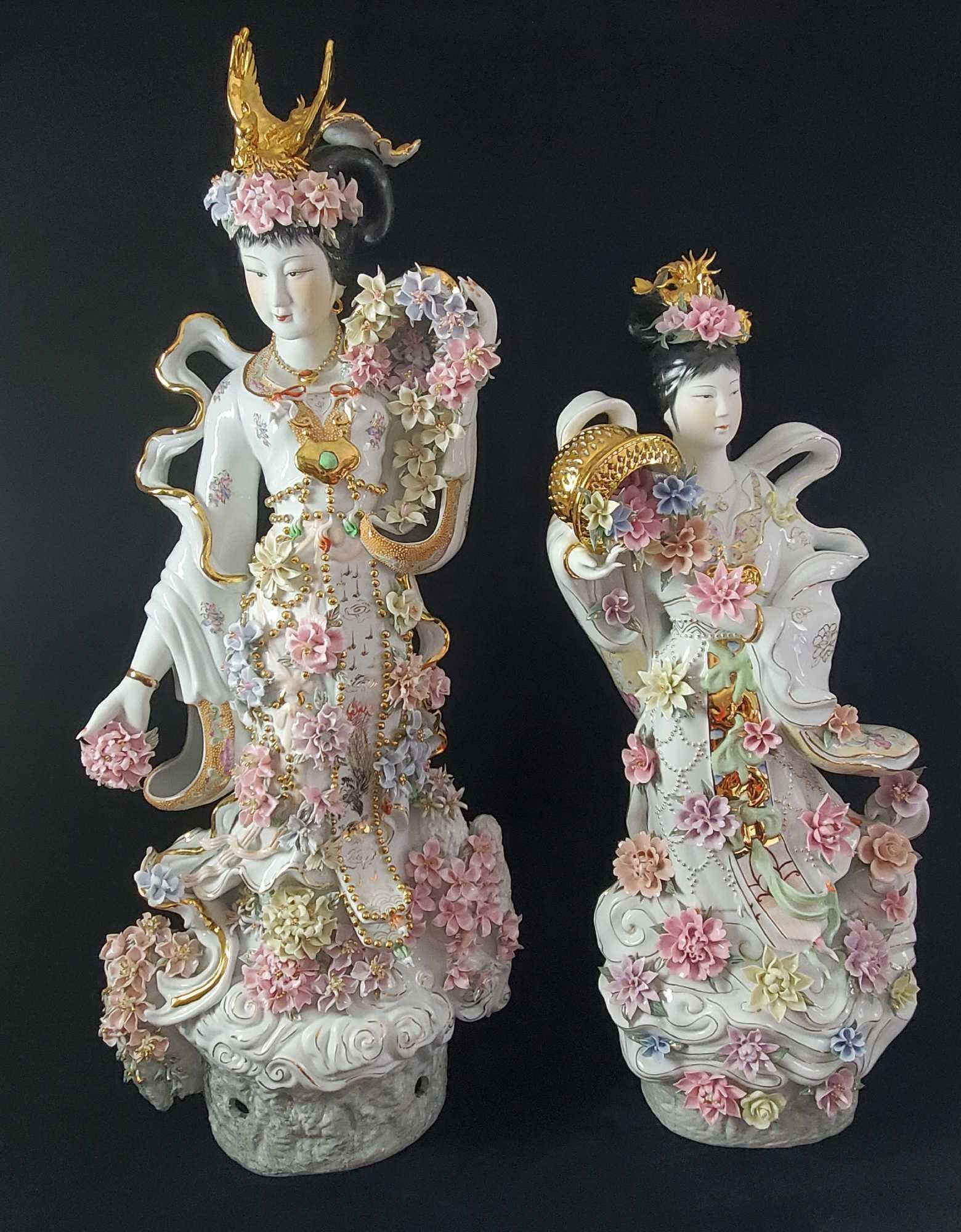 Pair of Japanese Geisha Girls Porcelain Sculptures: This pair of porcelain sculptures of Japanese Geisha girls depict an incredible amount of detail with hand painted design elements. White base with pastel and gold tone accents. The faces are matte