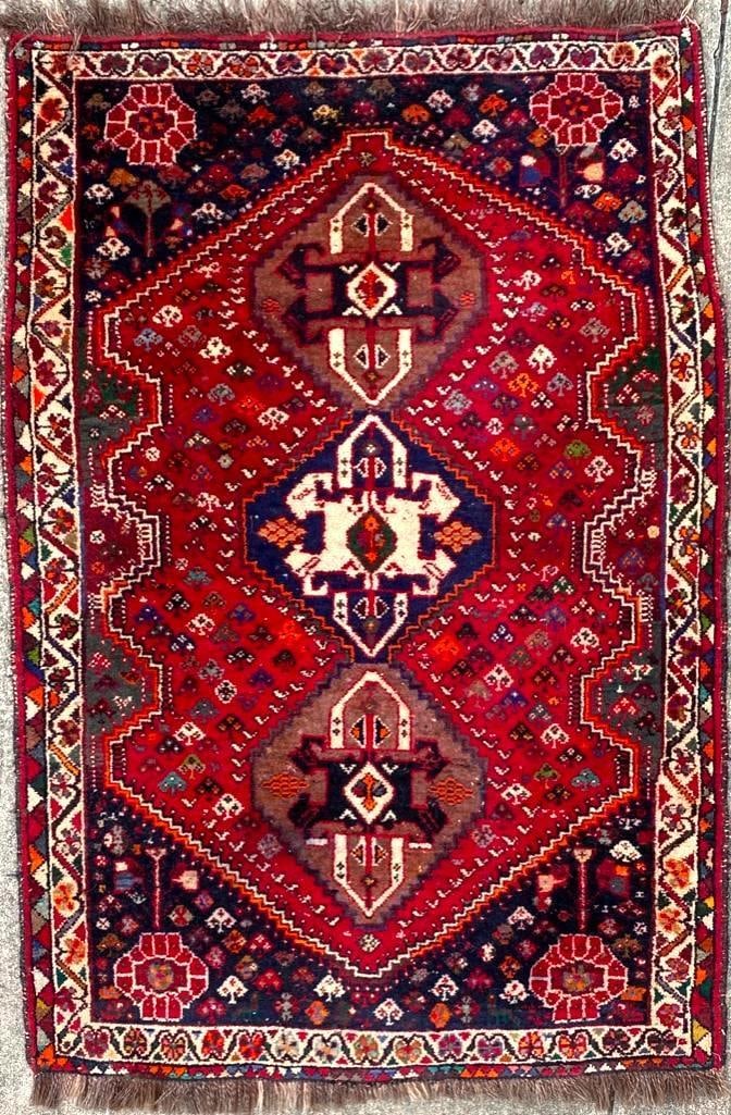 Vintage Persian Rug From Iran: Vintage Persian Rug From Iran Vintage hand-knotted wool rug imported pre-embargo from Iran in good condition. This example appears to be a Shiraz rug from the famed Fars region. The rug has been clea